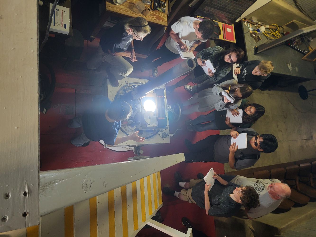 Students gathered around the Snow telescope spectrograph